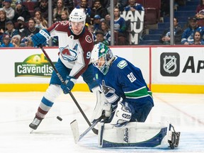 Colorado Avalanche winger Mikko Rantanen is on the doorstep as Canucks goalie Collin Delia makes a save during their Jan. 5 game at Rogers Arena.