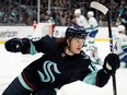 Jared McCann celebrates his power-play goal against the Canucks on Jan. 25 in Seattle.