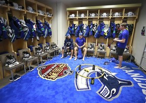 Derek Dorsett #15 of the Vancouver Canucks talks to teammates Alexander Burmistrov (L) and Bo Horvat before their practice at Mercedes-Benz Arena September 19, 2017 in Shanghai, China. The Vancouver Canucks and LA Kings will play two pre-season games in China.