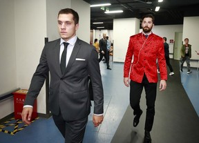 Erik Gudbranson #44 of the Vancouver Canucks sports a Chinese jacket as he walks behind teammate Bo Horvat #53 on their way to the team dressing room before their pre-season game against the Los Angeles Kings at the Mercedes-Benz Arena September 21, 2017 in Shanghai, China.