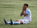 FC Edmonton's Gabriel Bitar (30) reacts to being stopped by York United FC's goalkeeper Gianluca Catalano (12) during first half Canadian Premier League action at Clarke Stadium in Edmonton, on Friday, July 1, 2022. Photo by Ian Kucerak