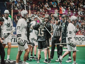 Shawn Evans and Logan Schuss celebrate during the Vancouver Warriors' 19-16 win over the Las Vegas Desert Dogs on Saturday at Rogers Arena.