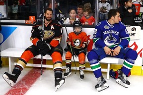 Ryan Kesler #17 of the Anaheim Ducks, his son Ryker Kesler and Bo Horvat #53 of the Vancouver Canucks take a break during the 2017 Coors Light NHL All-Star Skills Competition as part of the 2017 NHL All-Star Weekend at STAPLES Center on January 28, 2017 in Los Angeles, California.