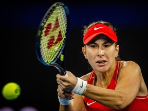 Switzerland's Belinda Bencic hits a return against Poland's Iga Swiatek during their women's singles match at the United Cup tennis tournament in Brisbane on January 2, 2023.
