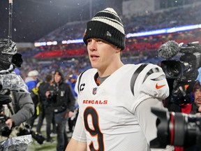 Cincinnati Bengals quarterback Joe Burrow (9) walks on the field after winning an AFC divisional round game against the Buffalo Bills at Highmark Stadium. Gregory Fisher-USA TODAY Sports