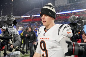 Cincinnati Bengals quarterback Joe Burrow (9) walks on the field after winning an AFC divisional round game against the Buffalo Bills at Highmark Stadium. Gregory Fisher-USA TODAY Sports