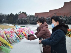 People visit the statues of North Korea's former president Kim Il Sung and chairman Kim Jong Il on Mansu Hill on the occasion of the Lunar New Year in Pyongyang, Sunday, Jan. 22, 2023.