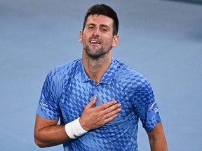 Novak Djokovic celebrates his victory against Stefanos Tsitsipas during the men's singles final of the Australian Open in Melbourne, Sunday, Jan. 29, 2023.