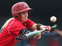 Team Ontario's Ashley Stephenson bunts during the Baseball Canada Women's Invitational Championship against Team Quebec at Father Cullen Stadium in Windsor, Ont., on Aug. 3, 2017.