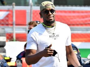 Usain Bolt is seen on the grid before the race.