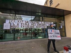 Protesters are seen outside the retirement home of Johannes Rivoire in Lyon, France on Monday Jan.16, 2023.