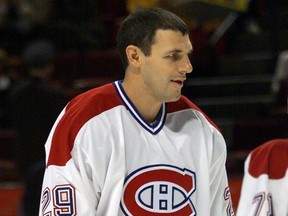 Montreal Canadiens Gino Odjick warms up before the game against the New York Rangers in Montreal on Oct. 15, 2001.