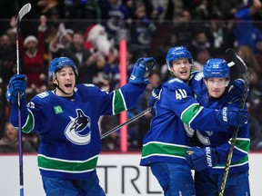 Andrei Kuzmenko, Elias Pettersson and Bo Horvat (left to right) have been three of the brighter lights for the Canucks so far this season, as the trio are all offensive leaders in terms of shot attempts.