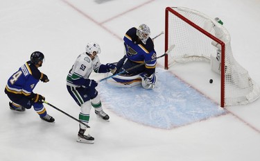 Vancouver Canucks center Bo Horvat (53) scores a shorthanded goal against the St. Louis Blues during the overtime period in game two of the first round of the 2020 Stanley Cup Playoffs at Rogers Place. Mandatory Credit: Perry Nelson-USA TODAY Sports