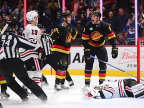 Vancouver Canucks forward Dakota Joshua, right, celebrates his goal with forward Bo Horvat against Chicago Blackhawks goalie Petr Mrazek at Rogers Arena.