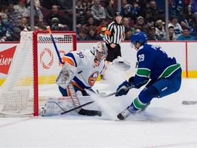 New York Islanders goalie Ilya Sorokin (30) makes a save on Vancouver Canucks forward Lane Pederson (29) in the first period at Rogers Arena. Bob Frid-USA TODAY Sports