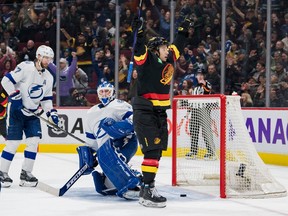 Canucks winger Andrei Kuzmenko celebrates his third-period goal — his 18th of the season — against Tampa Bay Lightning goalie Brian Elliott in Wednesday night’s NHL game at Rogers Arena.