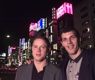 Pavel Bure and Gino Odjick check out the neon and restaurants in Tokyo's Shinjuku district.