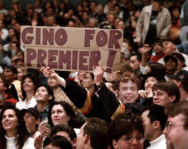 A Vancouver Canuck fan holds a sign supporting Gino Odjick during a game April 20, 1996.