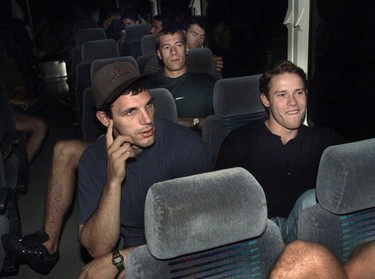 Vancouver Canuck favourites Gino Odjick (left) and Pavel Bure ride the team bus.