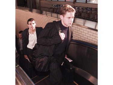 Vancouver Canucks Gino Odjick and Pavel Bure arrive at Narita Airport for two regular season games on Sept. 30, 1997.