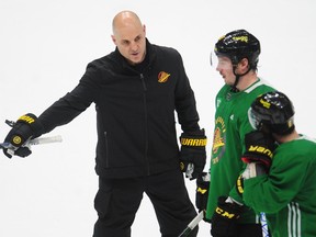 New Canucks head coach Rich Tocchet gives some direction to forward J.T. Miller during Tocchet’s first practice with the team in late January at Rogers Arena.