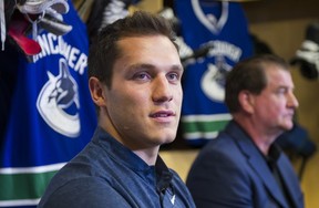 Vancouver Canucks Bo Horvat (left) and general manager Jim Benning speak with reporters at the South Okanagen Events Centre during a press conference after signing a six year contract with the team in Penticton, BC, September, 8, 2017. (Richard Lam/PNG)