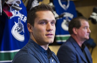 Vancouver Canucks Bo Horvat (left) and general manager Jim Benning speak with reporters at the South Okanagen Events Centre during a press conference after signing a six year contract with the team in Penticton, BC, September, 8, 2017. (Richard Lam/PNG)