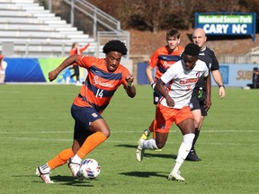 Canadian forward Levonte Johnson (left) is shown in action for Syracuse University in a 2-0 win over Clemson on Nov. 13, 2022, in the ACC Tournament championship game in Cary, N.C.