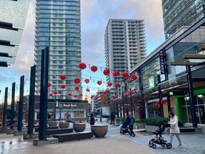 Red lunar new year lanterns decorate the main plaza of the massive new agglomeration of towers at Cambie and SW Marine Drive in Vancouver, which some inhabitants say tends to feel "cold" and, in evenings, too quiet.