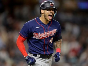 Minnesota Twins shortstop Carlos Correa reacts after hitting a two-run home run against the New York Yankees during a Sept. 8, 2022 American League game at Yankee Stadium in New York.