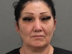 Brigitte Cleroux, pictured in a police handout, faces charges for impersonation and fraud for posing as a nurse at B.C. Women's Hospital between 2020 and 2021.