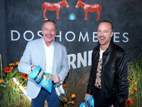 Bryan Cranston and Aaron Paul, stars of PopCorners Breaking Good Super Bowl commercial, attend Dos Hombres Mezcal x PopCorners event at Jetset Hangar on February 09, 2023 in Scottsdale, Arizona.