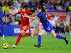 Christine Sinclair #12 of Canada controls the ball against Andi Sullivan #17 of the United States during the first half in the 2023 SheBelieves Cup match at Exploria Stadium on February 16, 2023 in Orlando, Florida.