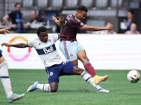 Colorado Rapids' Jonathan Lewis gets harassed by Vancouver Whitecaps defender Javain Brown during their game last August.