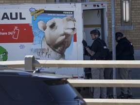 Members of the NYPD bomb squad examine a rental truck that was stopped and the driver arrested, Monday, Feb. 13, 2023, in New York.