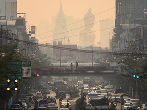 The giant Buddha statue of Wat Paknam Phasi Charoen temple is seen amid air pollution in Bangkok, Thailand, Feb. 2, 2023.