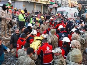 A woman is rescued from the rubble of a building some 203 hours after last week's devastating earthquake, in Hatay, Turkey February 14, 2023.