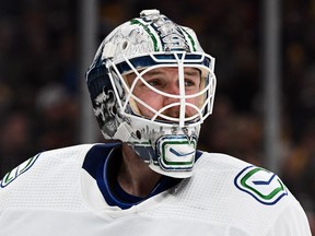 Vancouver Canucks goaltender Thatcher Demko (35) looks down the ice during a commercial break in the third period of a game against the Boston Bruins at the TD Garden. Brian Fluharty-USA TODAY Sports