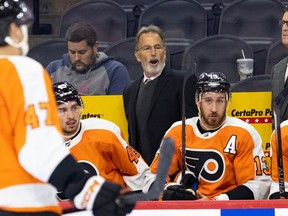 Philadelphia Flyers head coach John Tortorella talks to his players during the first period against the New York Islanders at Wells Fargo Center.