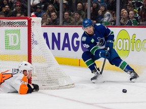 Philadelphia Flyers defenceman Nick Seeler dives to block a shot taken by Vancouver Canucks forward Andrei Kuzmenko in the third period at Rogers Arena. Canucks won 6-2.
