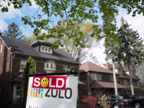 A sold sign is shown in front of west-end Toronto homes on May 14, 2017.