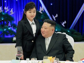North Korean leader Kim Jong Un talks with his daughter Kim Ju Ae at a banquet to celebrate the 75th anniversary of the Korean People's Army the following day, in Pyongyang, North Korea, Feb. 7, 2023 in this photo released Feb. 8, 2023 by North Korea's Korean Central News Agency (KCNA).