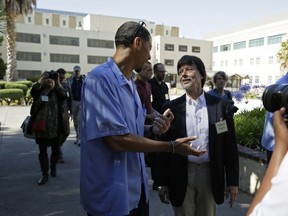 FILE - Filmmaker Ken Burns walks with inmate Rahsaan Thomas at San Quentin State Prison in San Quentin, Calif., on July 24, 2019. Thomas, a co-host of Ear Hustle, the Pulitzer Prize-nominated podcast produced behind bars, was released from San Quentin State Prison on Wednesday, Feb. 8,2023, a year after California's governor commuted his sentence.