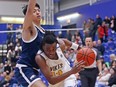 UVic Vikes guard Renoldo Robinson drives on UBC Thunderbirds Jack Cruz-Dumont during their men's basketball semifinal game at CARSA gym on Friday. (ADRIAN LAM, TIMES COLONIST)