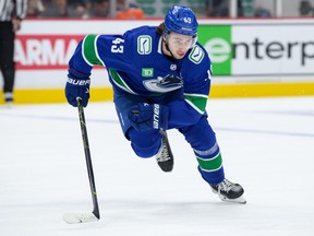 Vancouver Canucks defenceman Quinn Hughes skates up ice during their NHL game against the Anaheim Ducks at Rogers Arena on March 8, 2023 in Vancouver.