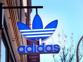 A sign hangs outside of an Adidas store on February 10, 2023 in Chicago, Illinois.