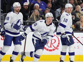 Nick Perbix #48, Vladislav Namestnikov #90 and Corey Perry #10 of the Tampa Bay Lightning celebrate Namestnikov's first-period goal against the Vegas Golden Knights during their game at T-Mobile Arena on February 18, 2023 in Las Vegas, Nevada.(Photo by Ethan Miller/Getty Images)