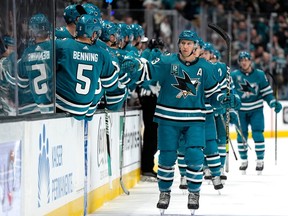 Nick Bonino #13 of the San Jose Sharks is congratulated by teammates after he scored a goal against the Chicago Blackhawks during the first period at SAP Center on February 25, 2023 in San Jose, California.