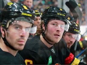 Brock Boeser of the Vancouver Canucks looks on from the bench during their NHL game against the Boston Bruins at Rogers Arena on Feb. 25, 2023.
